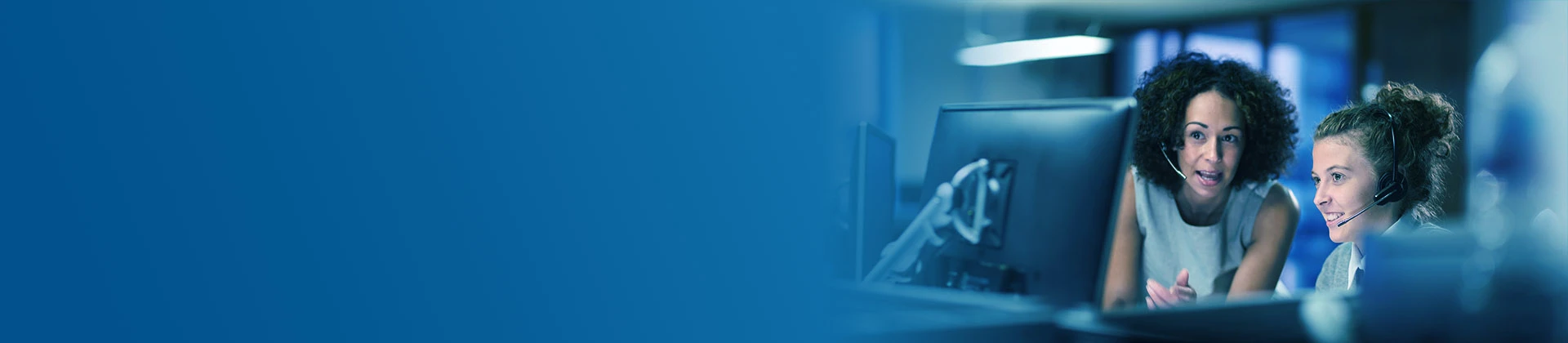 Customer support services team members helping client