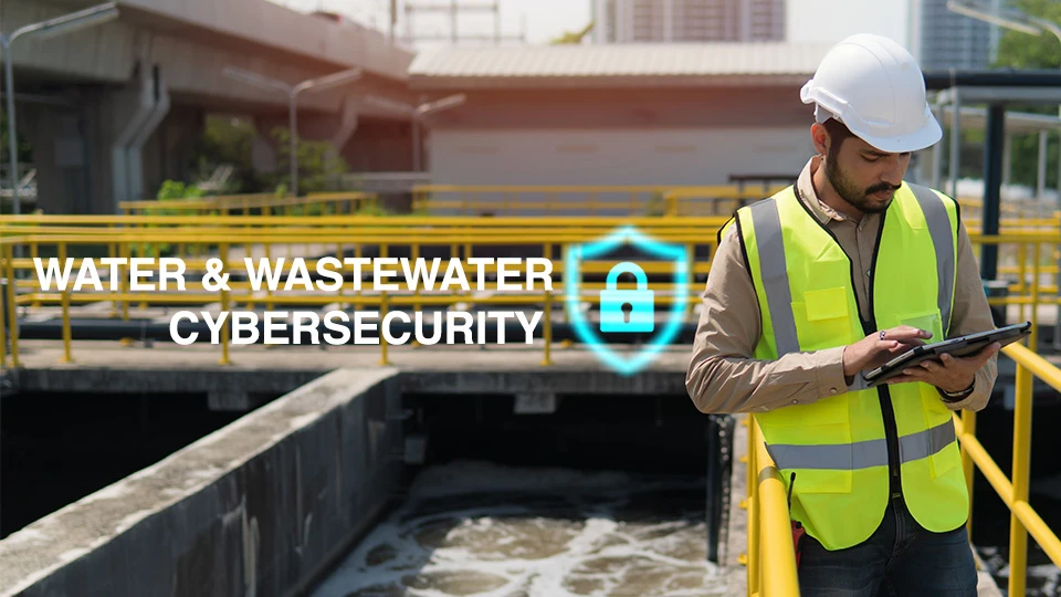 Water and Wastewater Cybersecurity blog image of man standing outside, wearing a hardhat and working on a tablet in a water treatment facility