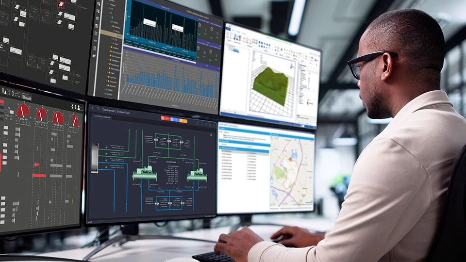 An engineer observing multiple SCADA dashboards 
